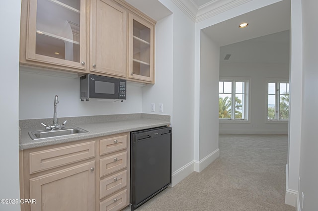 kitchen with light brown cabinetry, sink, vaulted ceiling, light carpet, and black appliances