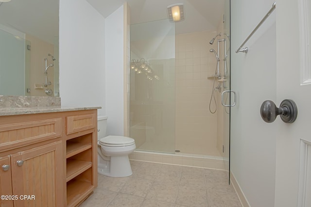 bathroom with walk in shower, vanity, and toilet