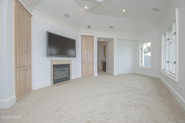 unfurnished living room featuring light colored carpet, ornamental molding, a tiled fireplace, and high vaulted ceiling