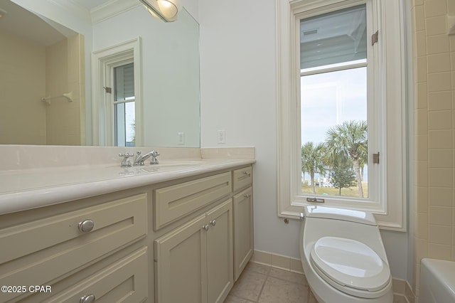 bathroom featuring tile patterned flooring, vanity, and toilet