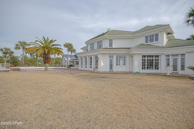 back of house with a patio and french doors