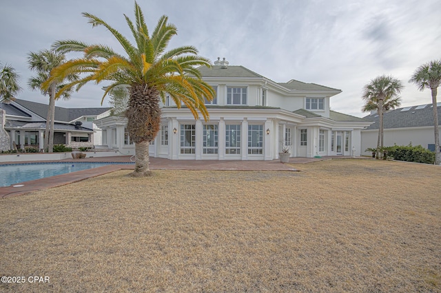 back of house with a patio