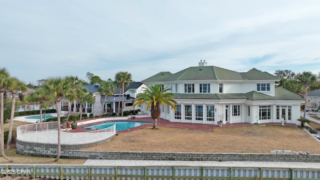 back of property featuring a patio