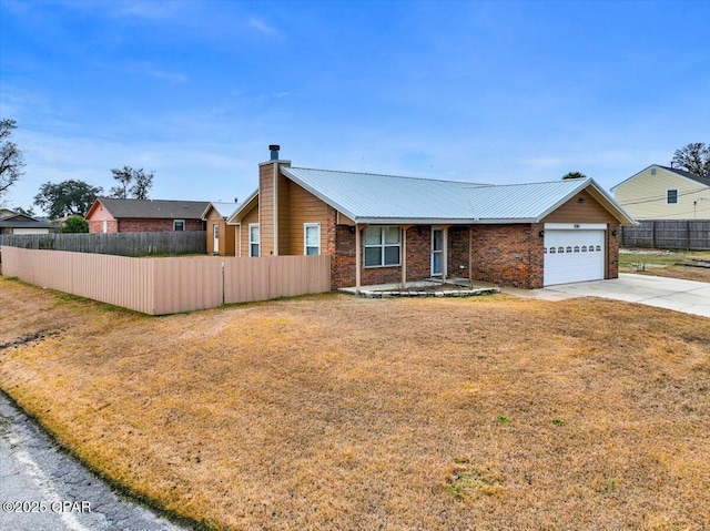 ranch-style home with a garage and a front yard