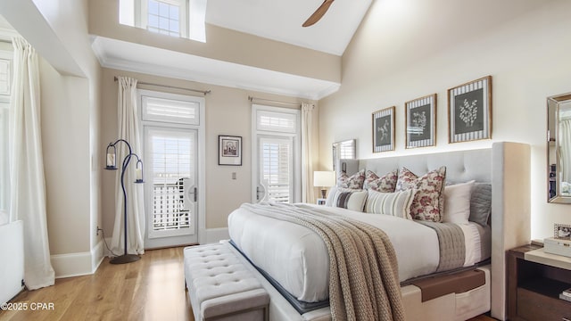 bedroom with vaulted ceiling, access to exterior, ceiling fan, light hardwood / wood-style floors, and crown molding