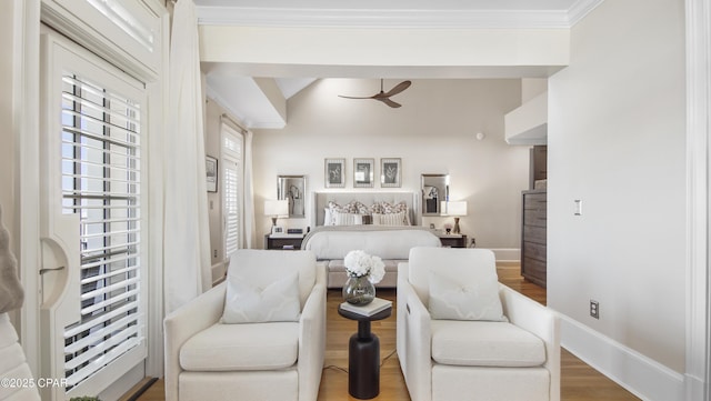 bedroom with wood-type flooring, ornamental molding, and vaulted ceiling