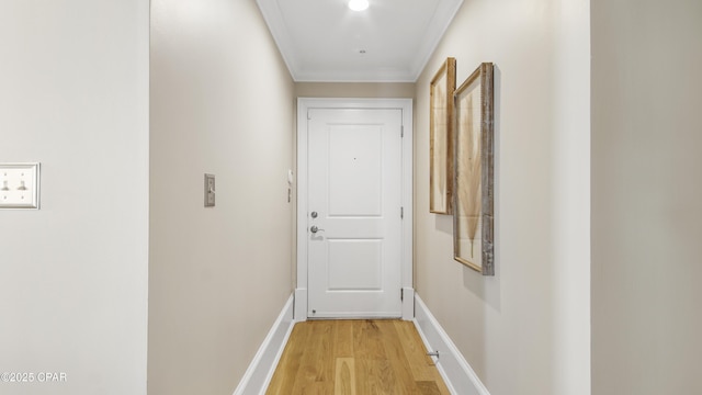 hallway with crown molding and light wood-type flooring