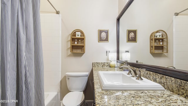 full bathroom with toilet, tiled shower / bath combo, and sink