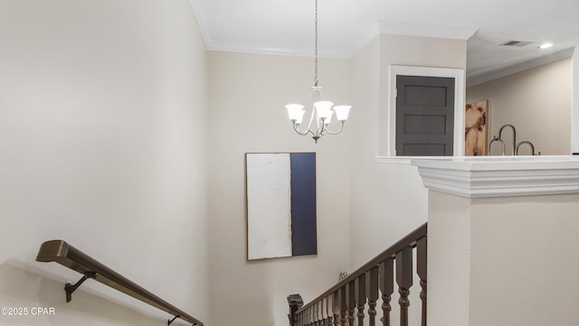 stairway featuring ornamental molding and an inviting chandelier