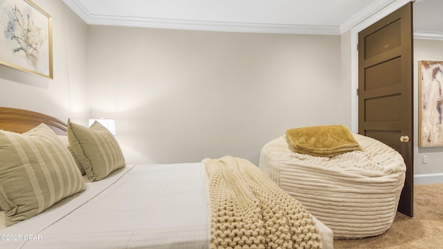 bedroom featuring ornamental molding and carpet