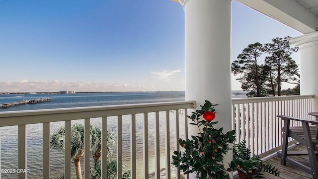 balcony featuring a water view