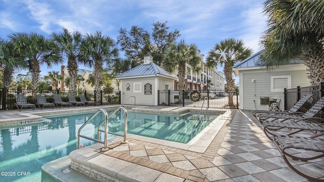 view of swimming pool featuring a patio area