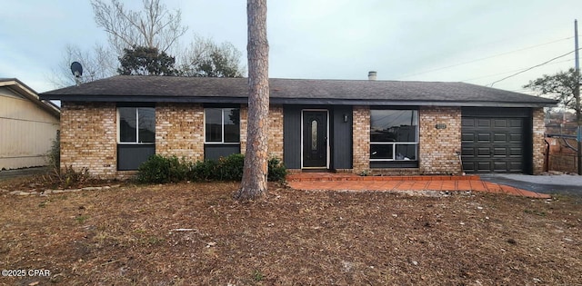 single story home featuring a garage