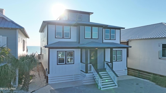 view of front of property featuring a water view