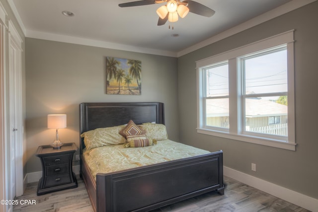 bedroom with ceiling fan and light hardwood / wood-style flooring