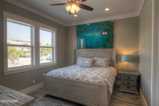 bedroom with ceiling fan and light hardwood / wood-style flooring