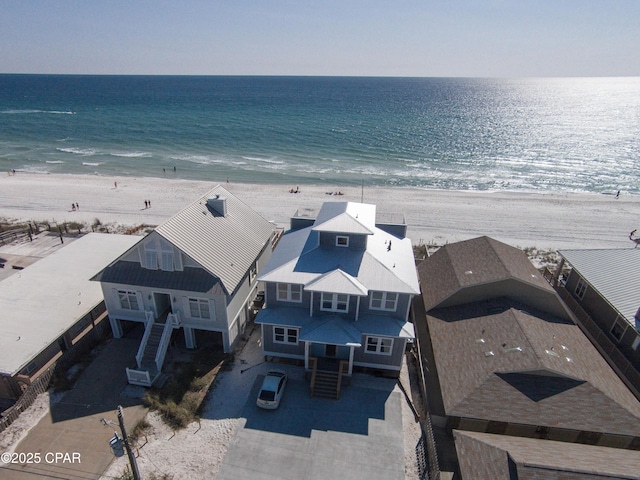 aerial view featuring a water view and a beach view