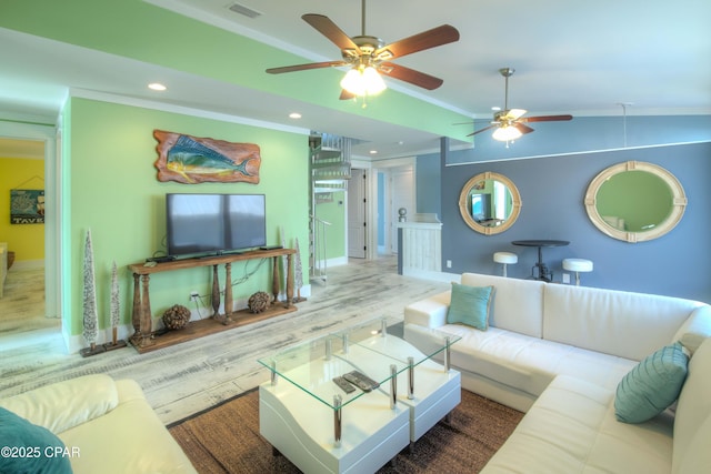 living room with crown molding, wood-type flooring, and vaulted ceiling