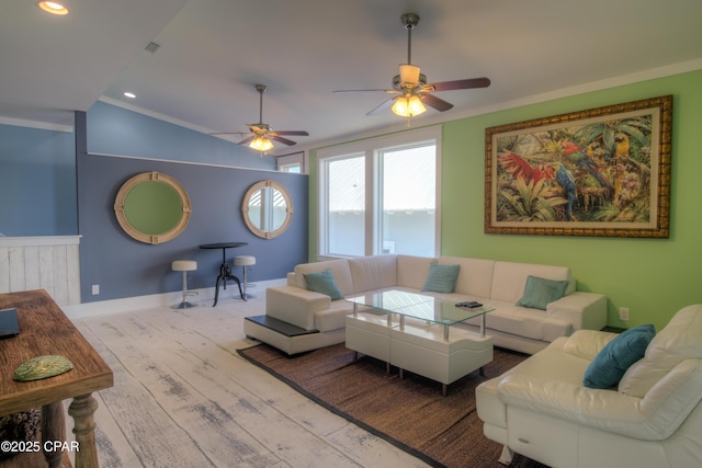 living room featuring crown molding, vaulted ceiling, and light hardwood / wood-style floors