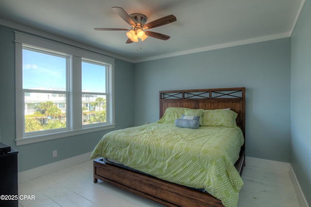 bedroom featuring ornamental molding and ceiling fan