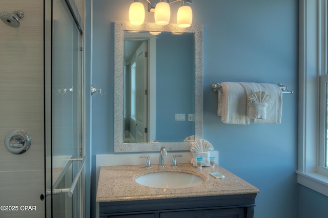 bathroom with vanity and an enclosed shower