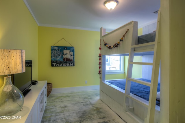 interior space with crown molding and light hardwood / wood-style flooring