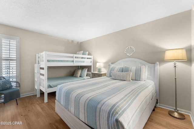 bedroom with light hardwood / wood-style floors