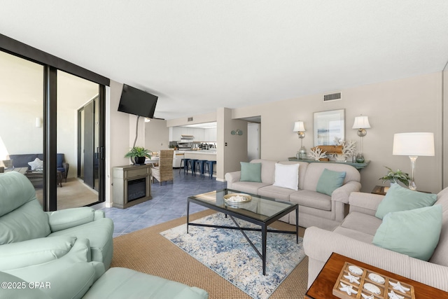 living room featuring light tile patterned flooring