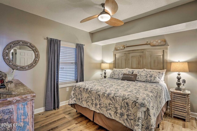 bedroom featuring ceiling fan and light hardwood / wood-style floors