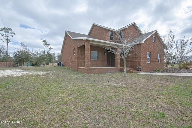 view of side of property featuring a yard