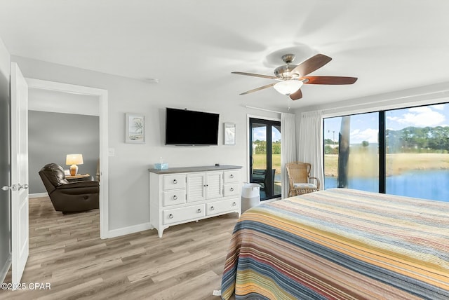 bedroom with ceiling fan, access to exterior, and light wood-type flooring