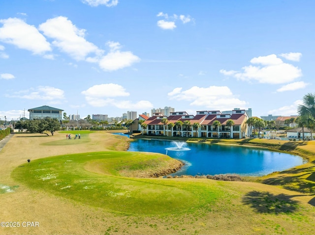 view of home's community featuring a water view and a lawn