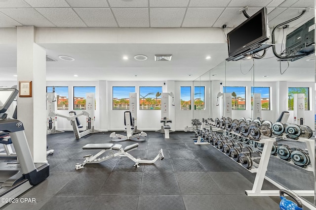 exercise room featuring a paneled ceiling