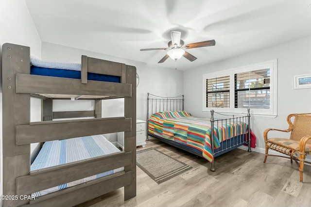 bedroom featuring ceiling fan and light wood-type flooring