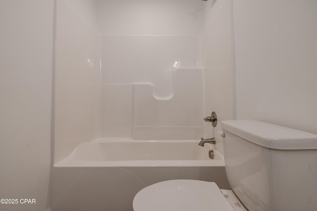 full bathroom featuring bathing tub / shower combination and toilet