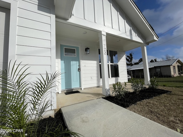 entrance to property featuring board and batten siding