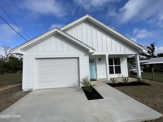 view of front of house with a garage, board and batten siding, and concrete driveway