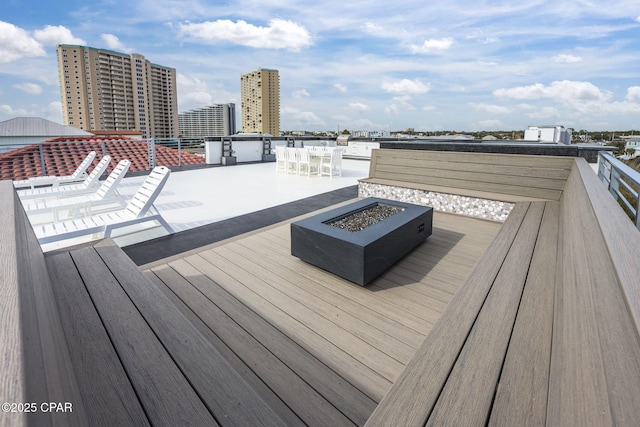 deck featuring a patio area and an outdoor fire pit