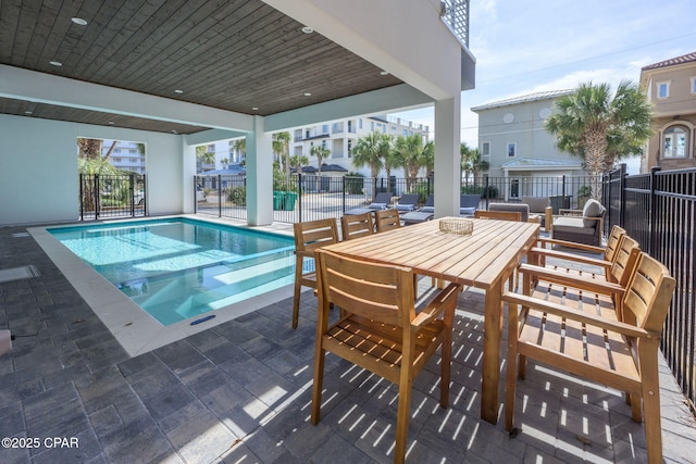 view of swimming pool featuring a patio area