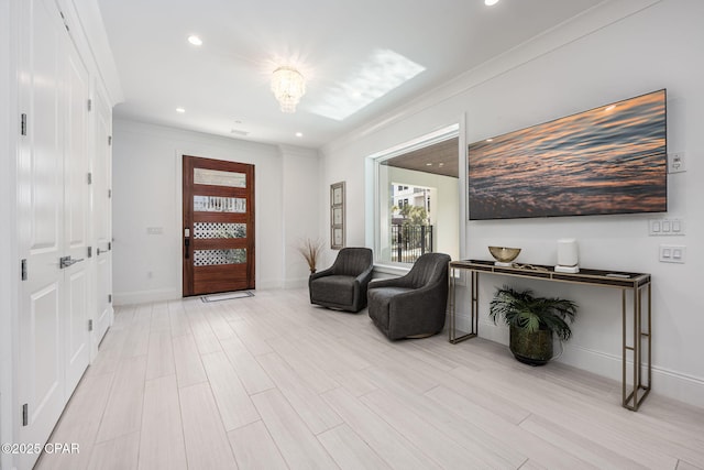 entryway featuring crown molding and light hardwood / wood-style floors