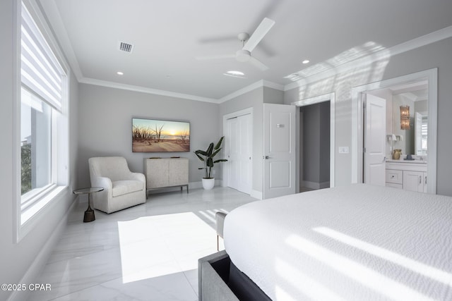 bedroom featuring ornamental molding, ceiling fan, ensuite bath, and a closet