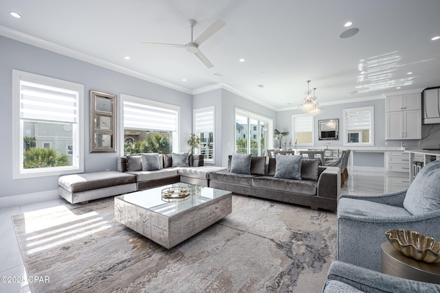 living room featuring ceiling fan and ornamental molding