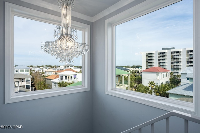 interior space featuring an inviting chandelier and a healthy amount of sunlight