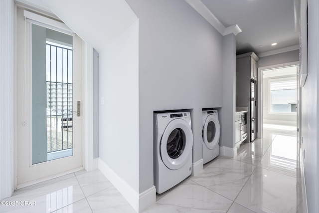laundry room featuring ornamental molding and independent washer and dryer