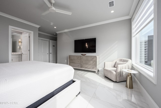 bedroom with ornamental molding, connected bathroom, and ceiling fan