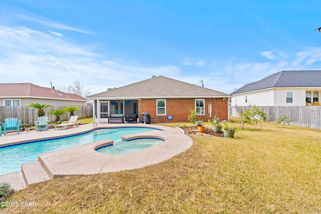 view of pool with a fenced backyard, an in ground hot tub, a yard, a fenced in pool, and a patio area