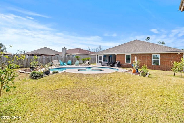 exterior space featuring a yard, a fenced backyard, a fenced in pool, and an in ground hot tub