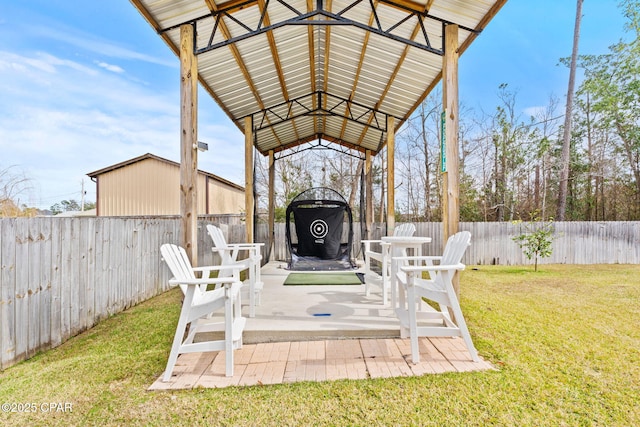 view of patio / terrace with a fenced backyard and a gazebo