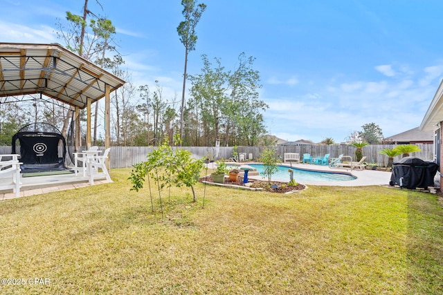 view of yard featuring a fenced backyard, a patio, a fenced in pool, and a gazebo