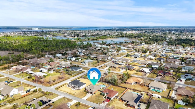 birds eye view of property featuring a water view and a residential view